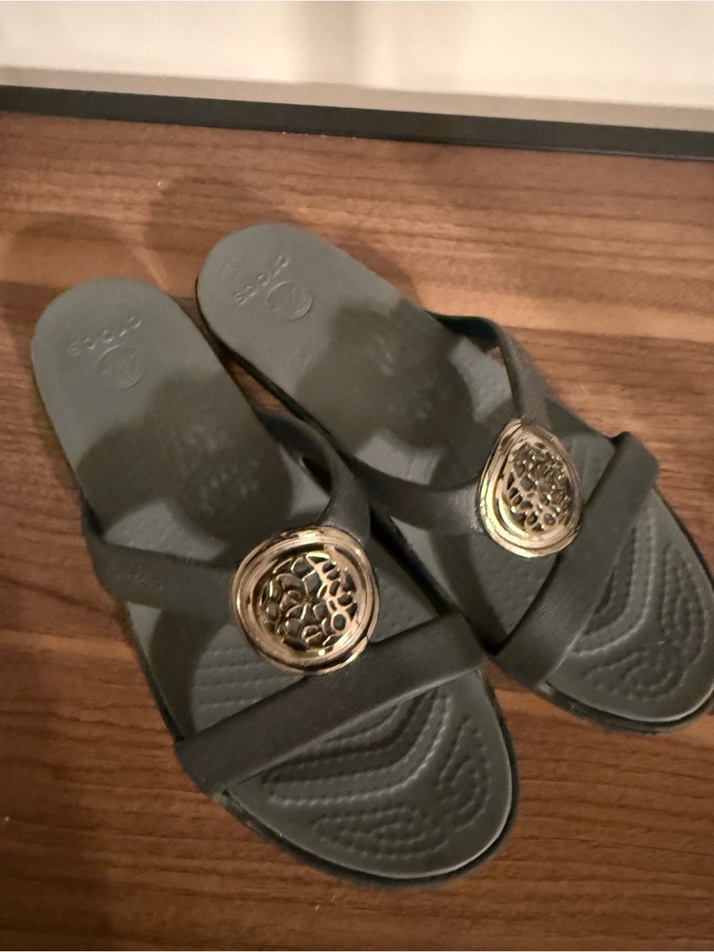 CROCS Black Slide Sandals with Gold Medallion